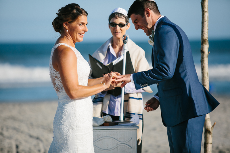 Unique outdoor wedding ceremony on the beach on a beautiful day in October.