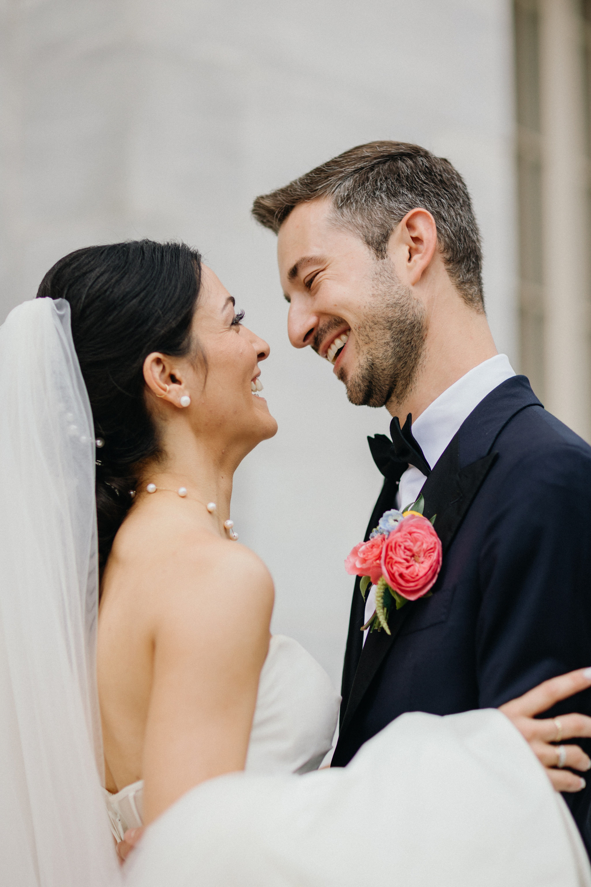 Bride and groom stare into each others eyes outside of the Merchant Exchange in Old City.