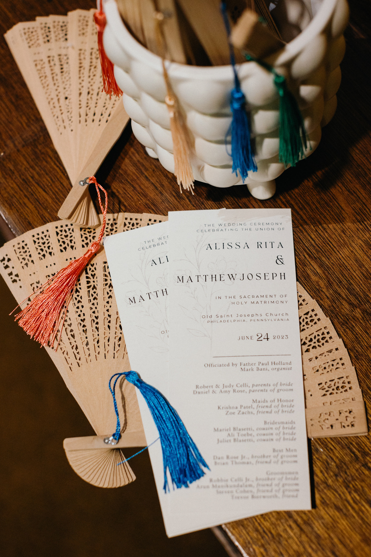 Photo of tan paper fans and wedding ceremony. brochure.