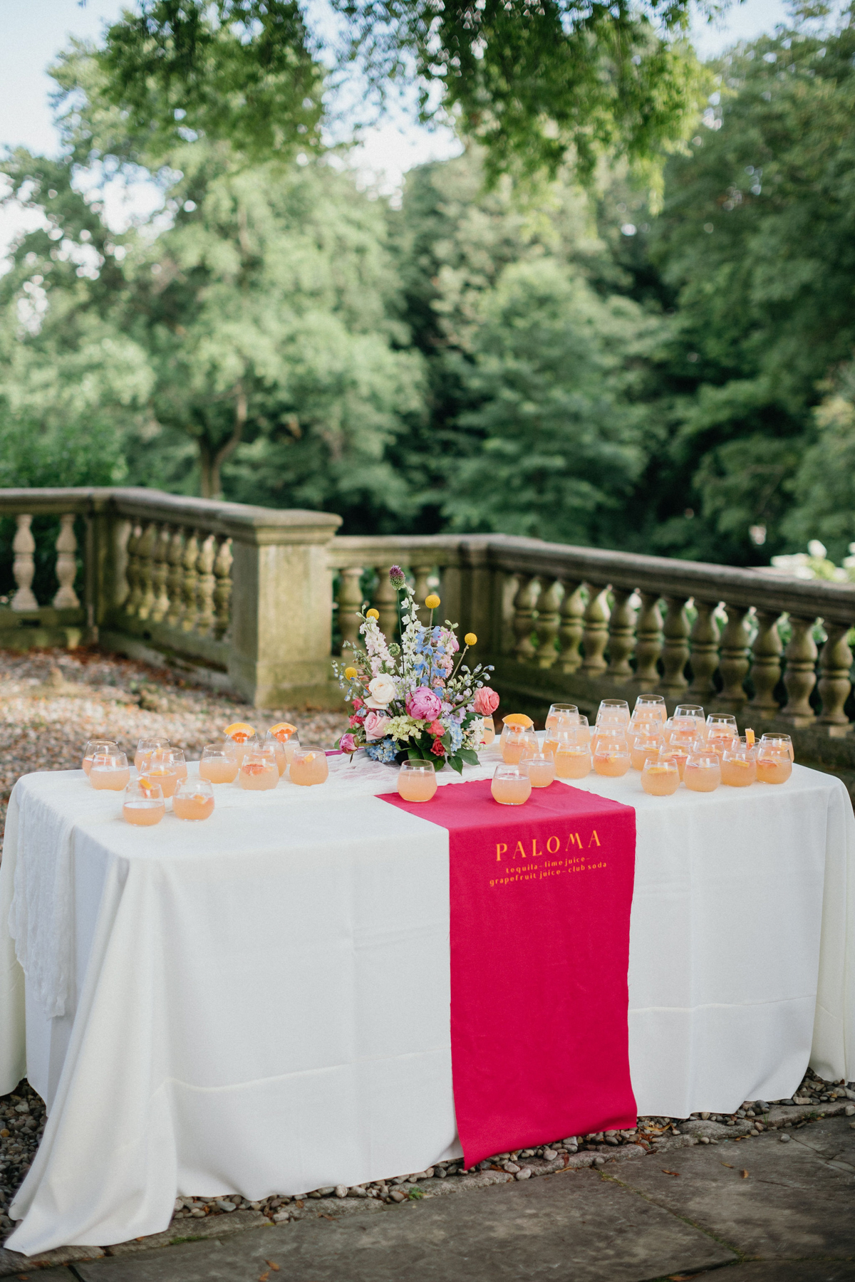 Colorful cocktail hour table at a castle like wedding venue in Philadelphia, PA.