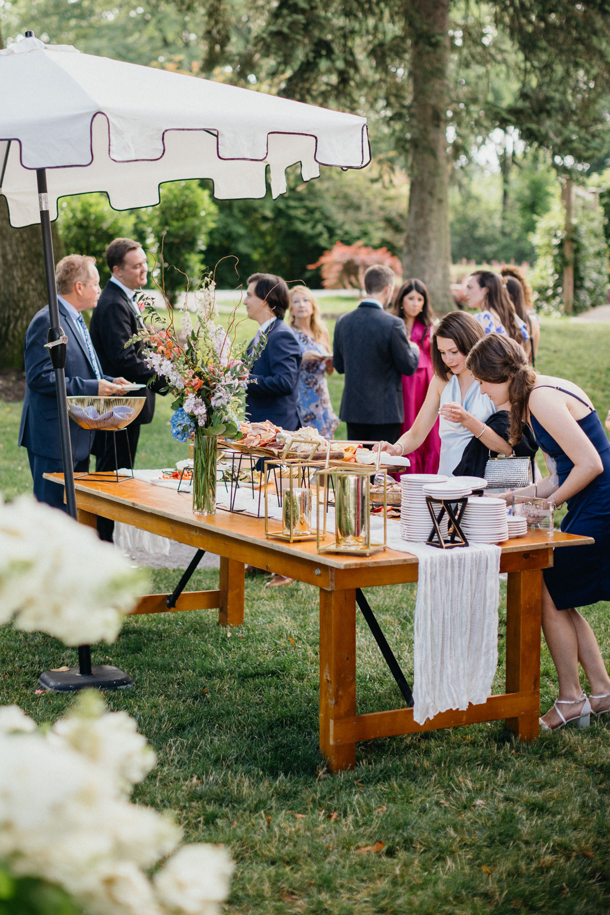 Guests enjoying cocktail hour at a Curtis Arboretum Wedding in Philadelphia, PA.