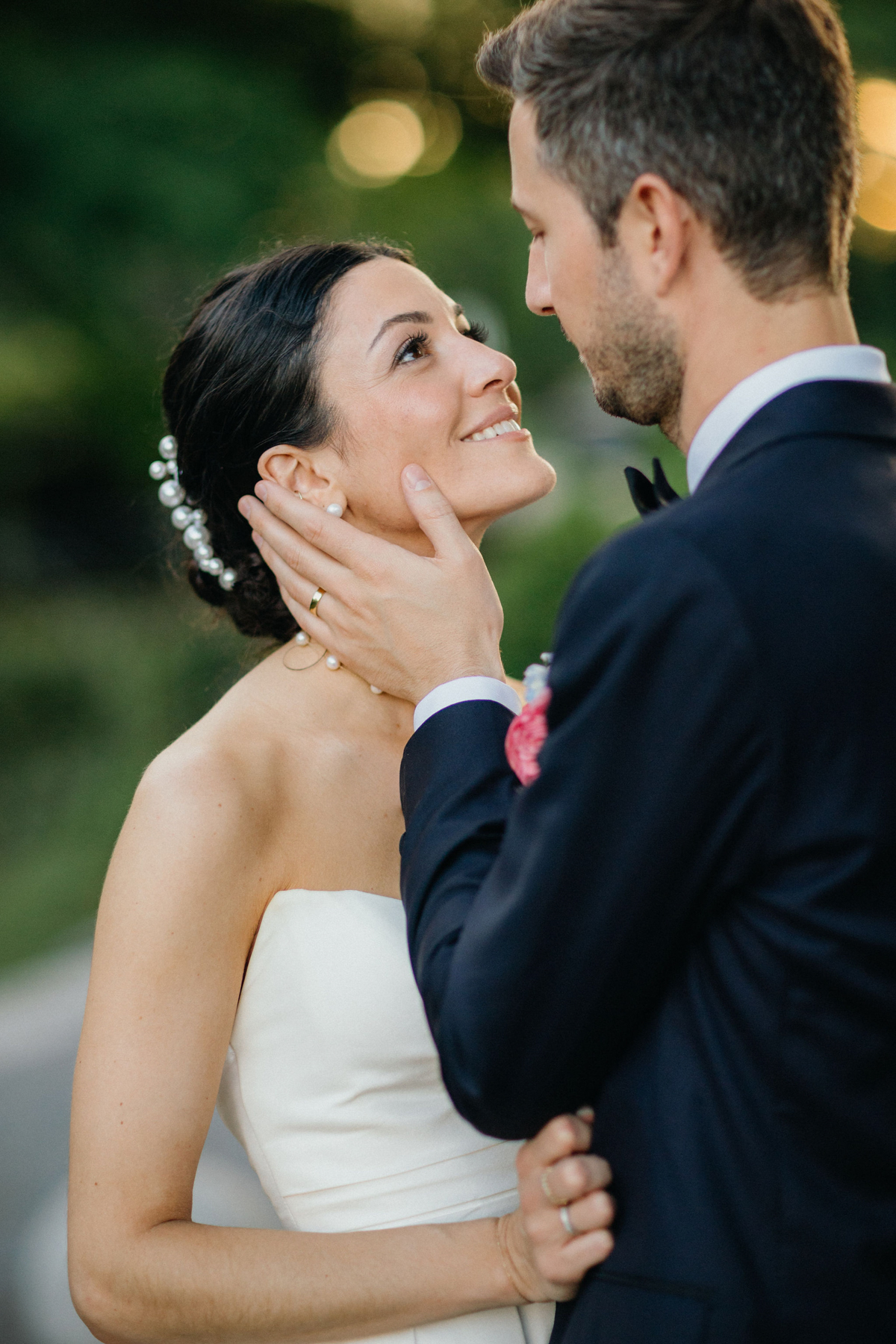 Candid photo of bride and groom at their outdoor wedding reception.