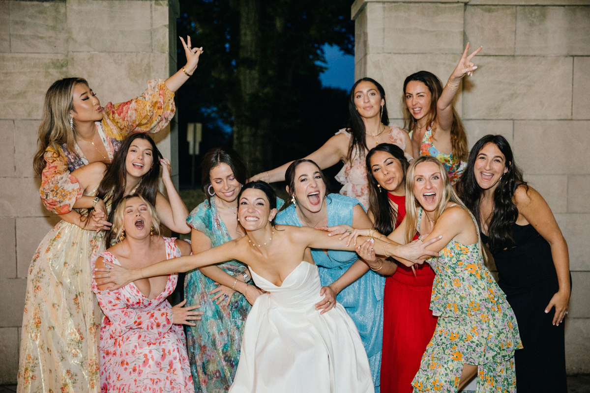 Fun, spur of the moment photos of bride and her college friends at her outdoor summer wedding in Philly