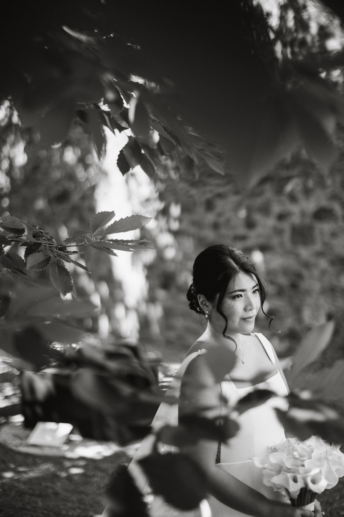 Black and white photo of a bride in the outdoor courtyard at the James A. Michener Museum. 