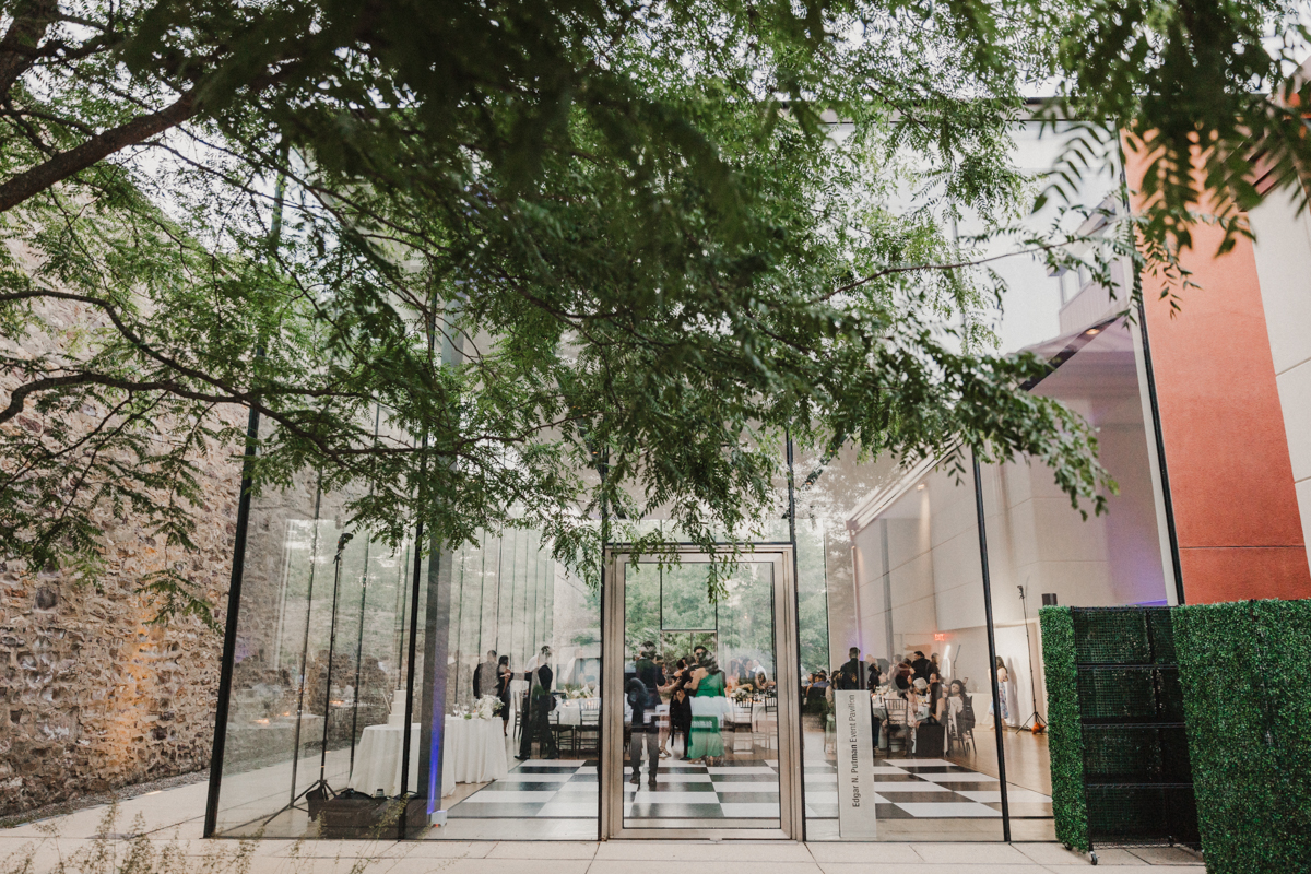 View from outside of the glass wedding reception space.