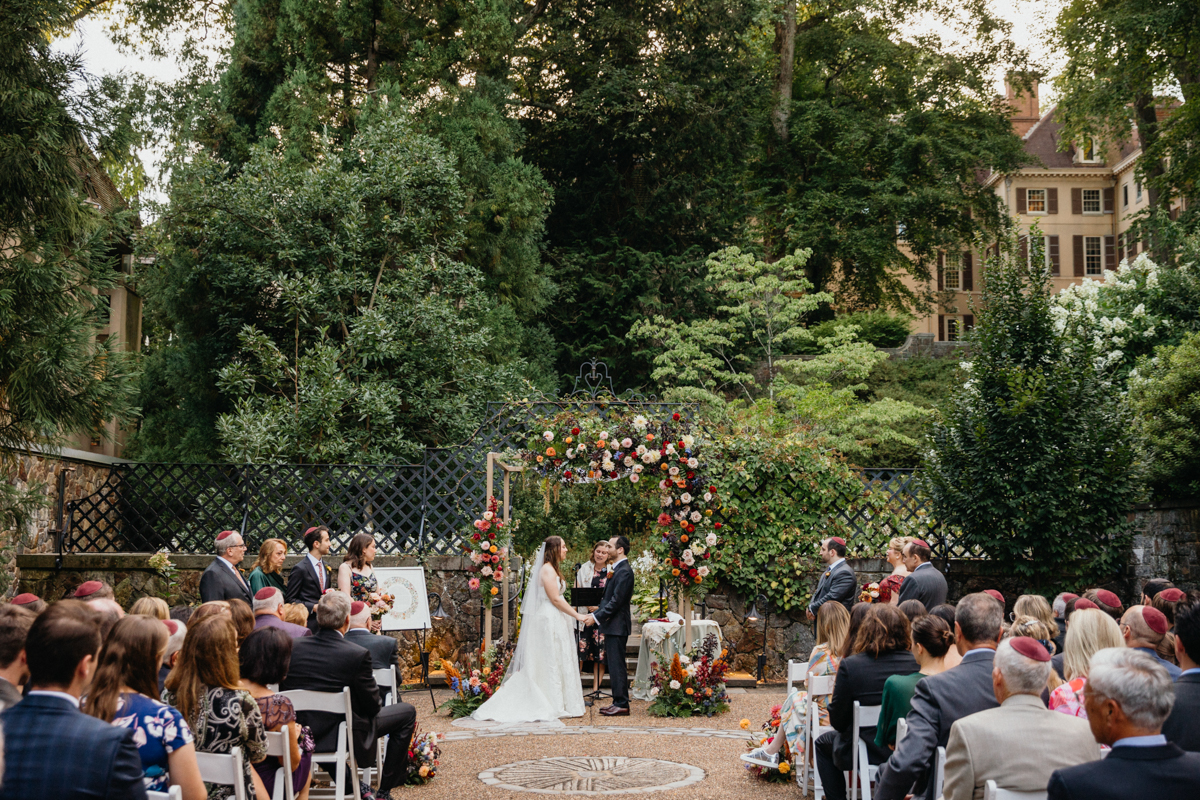 Colorful wedding ceremony arch at Winterthur Museum and Gardens in Winterthur, Delaware.