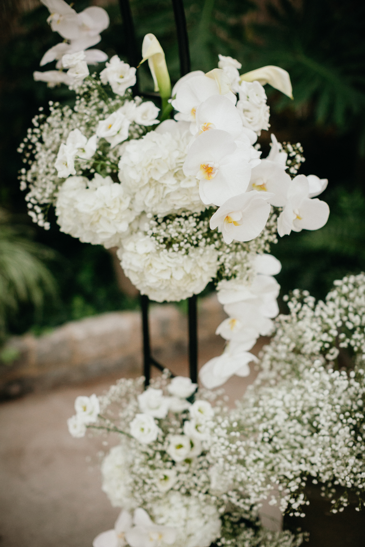 White wedding day centerpieces with baby's breath.