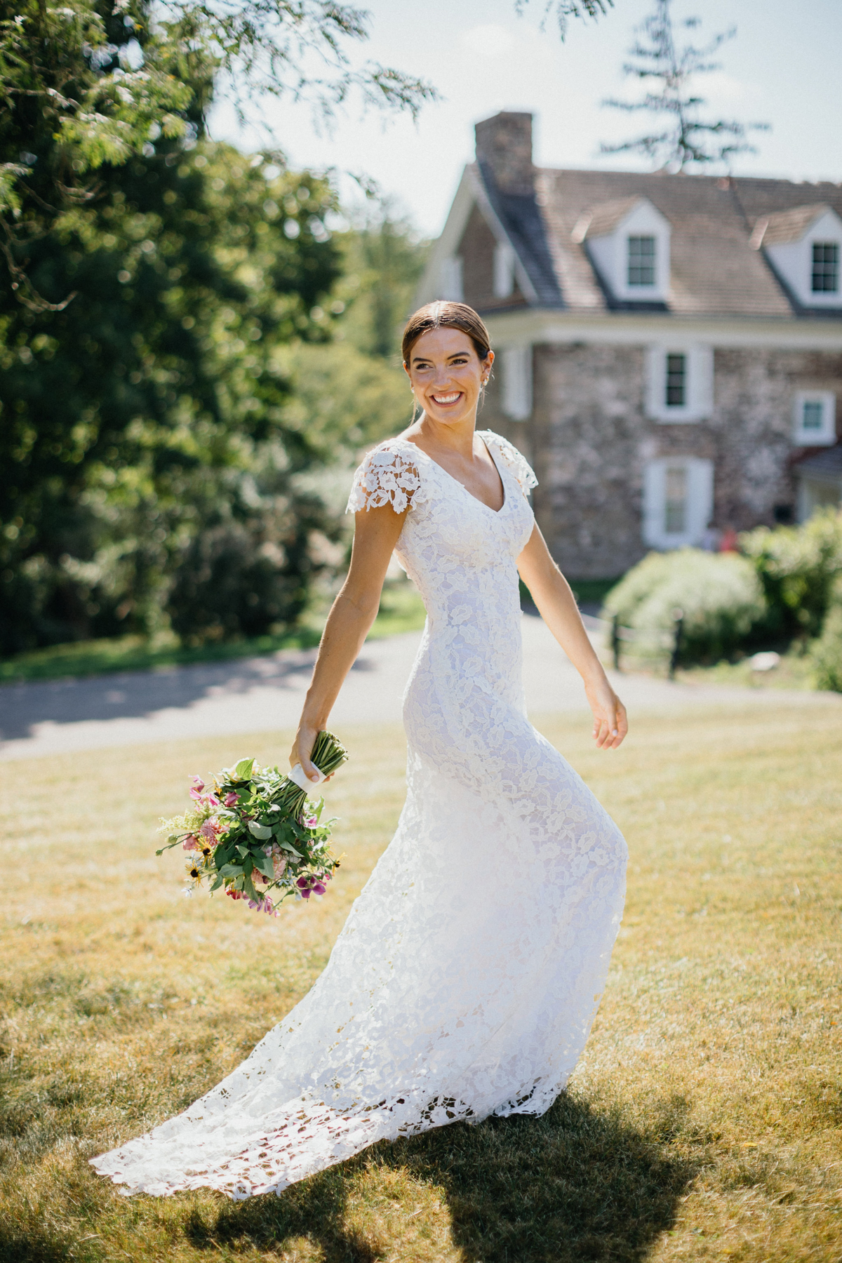 Toni walking candidly across the lawn of the Audubon Center near Philadelphia, PA before her wedding. 