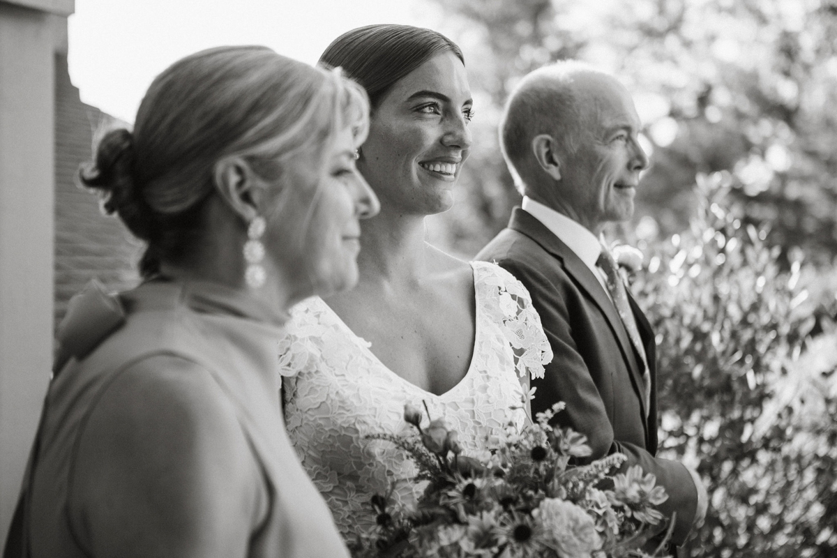 Black and white candid of Toni before walking down the aisle. 