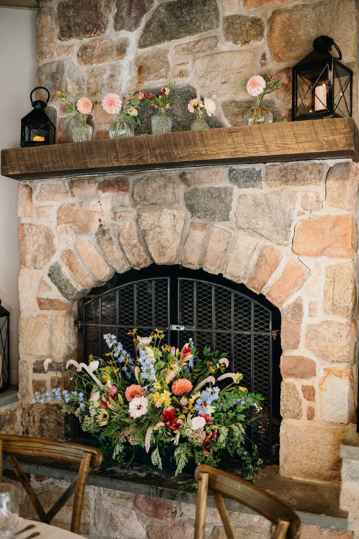 Fireplace with a wildflower centerpiece at the bottom.