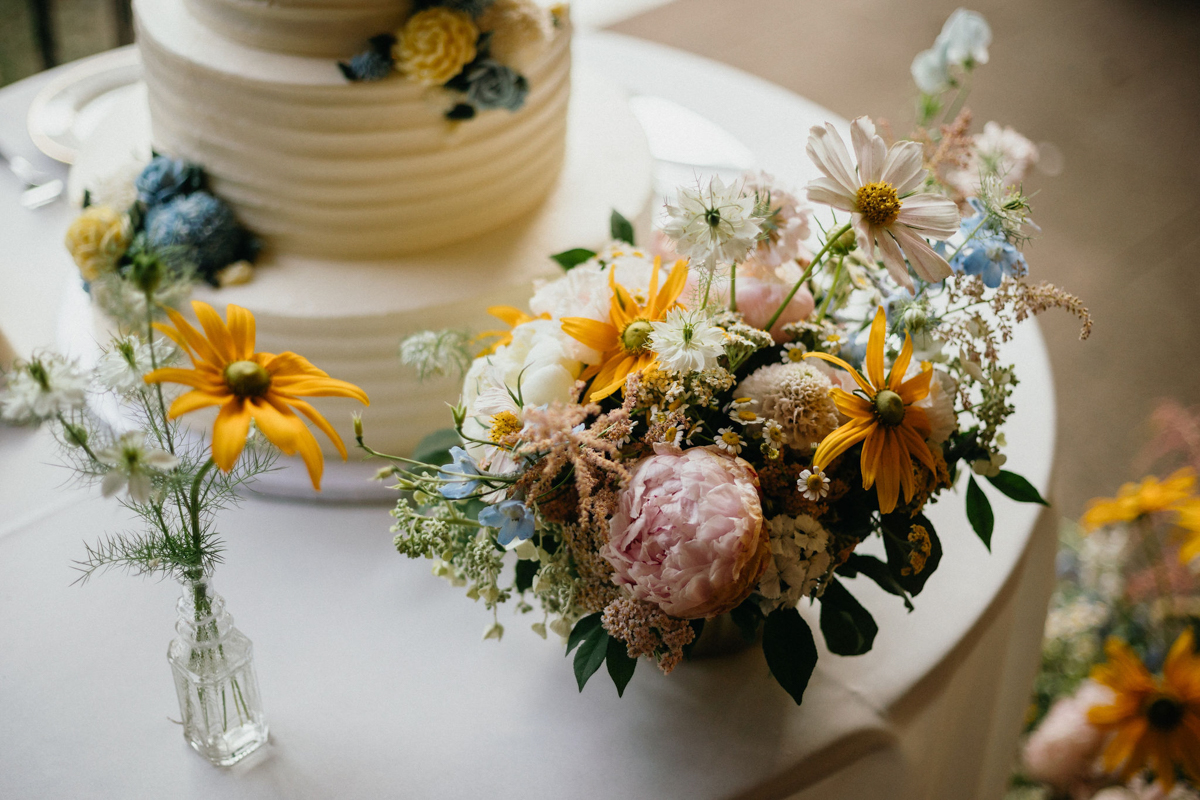 Spring wedding cake and florals at Philander Chase Knox Estate wedding outdoor reception.