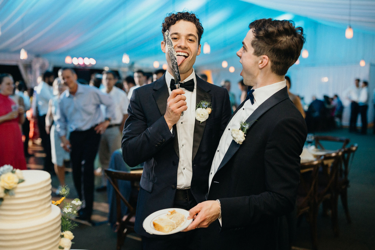 Cake cutting at lgbtq wedding reception in Valley Forge, outside of Philly.