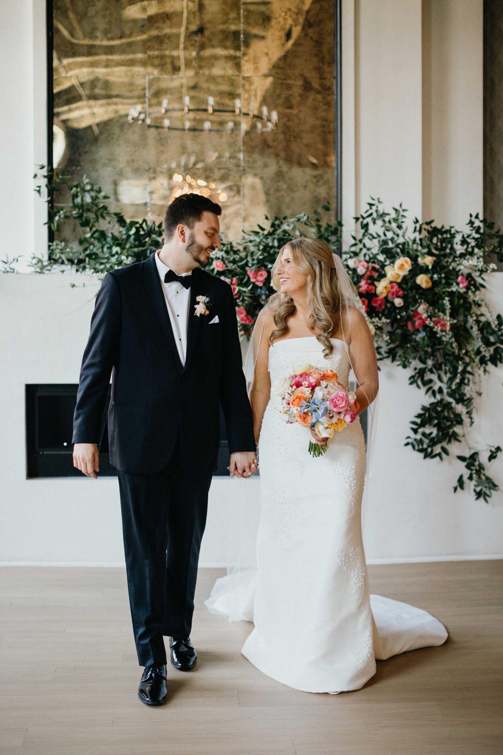 Playful laughter between the newlyweds in an industrial setting.