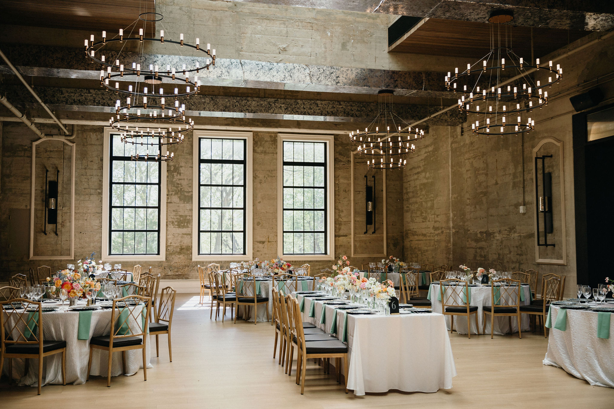 Bold blooms pop against the industrial backdrop of this wedding.