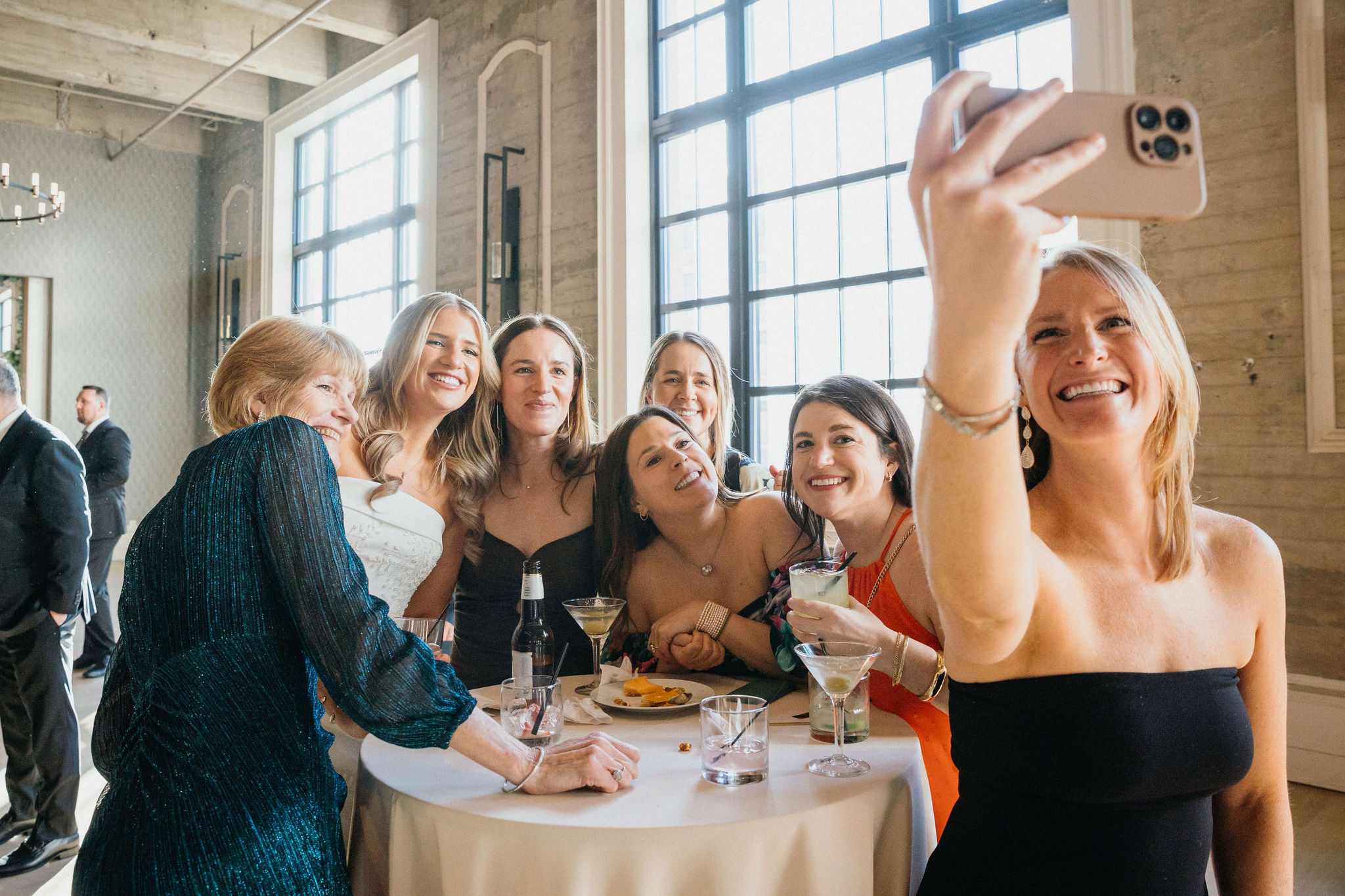 A warm hug between the newlyweds and their closest friends.