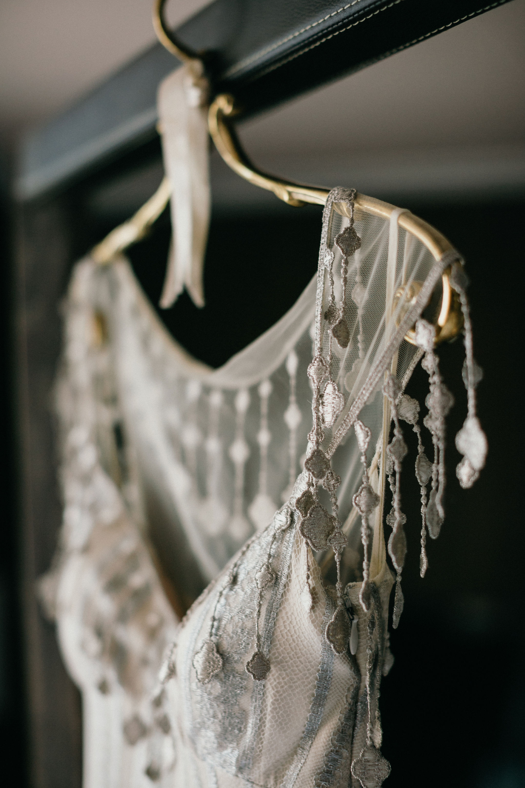 Nontraditional wedding dress with beadwork and teadrop jewels.