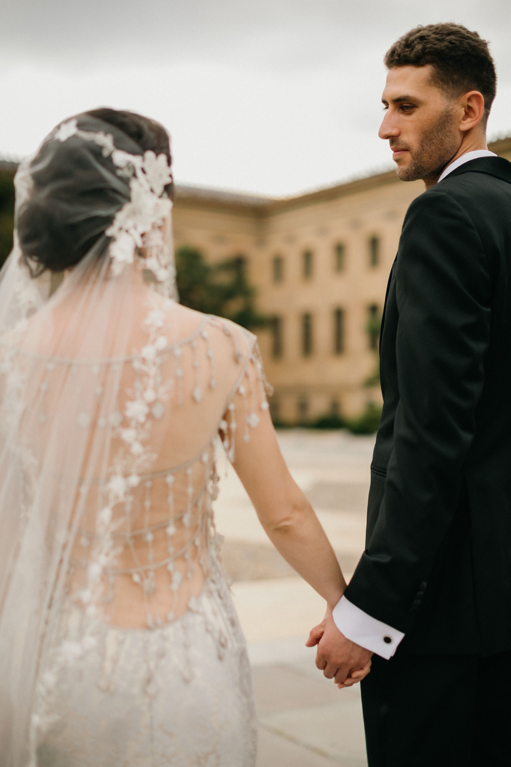 A wedding moment captured at the Philadelphia Museum of Art with artistic details.