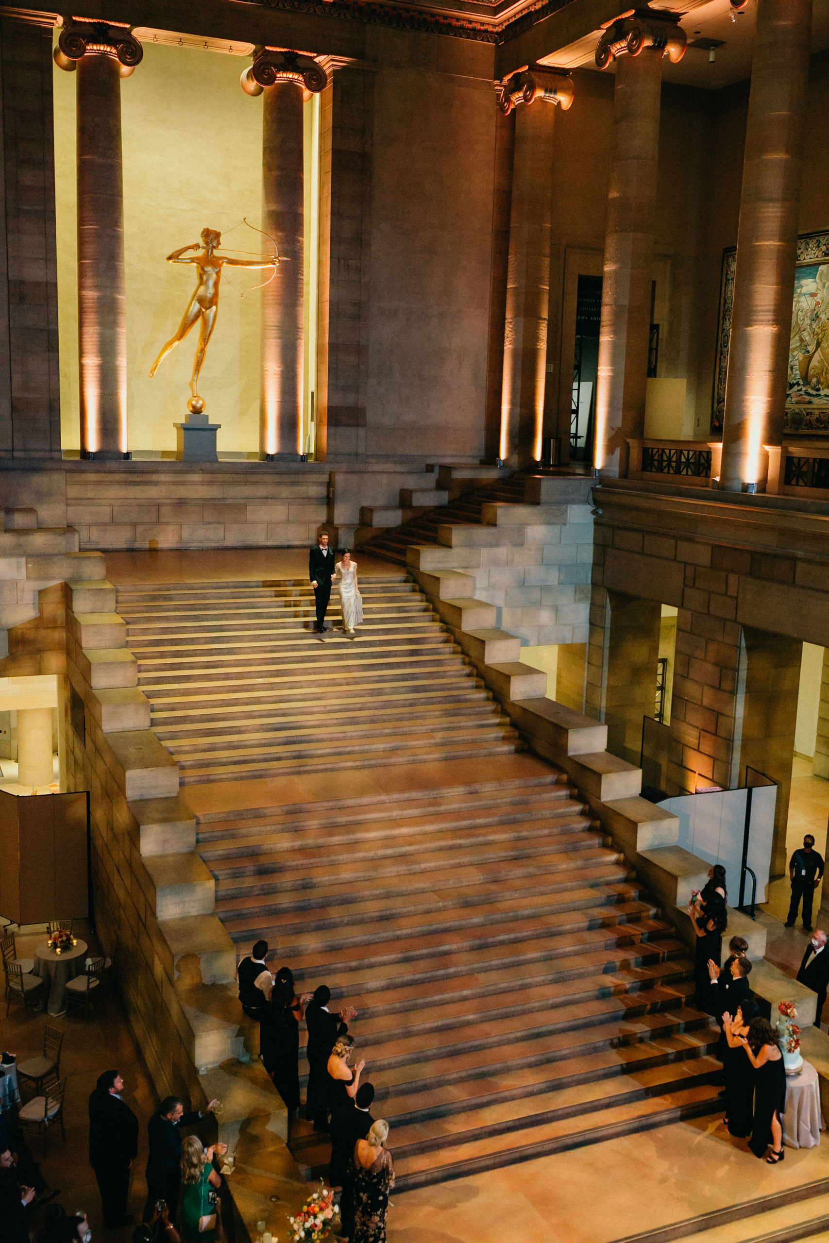 A joyful wedding moment set against the artistic backdrop of the Philly Art Museum.