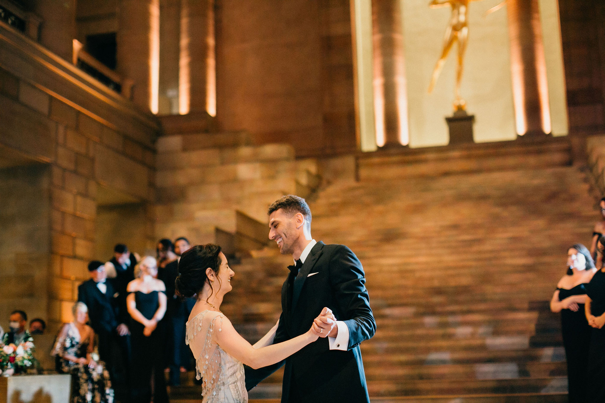 Newlyweds share a dance in a creatively styled reception space at the PMA.