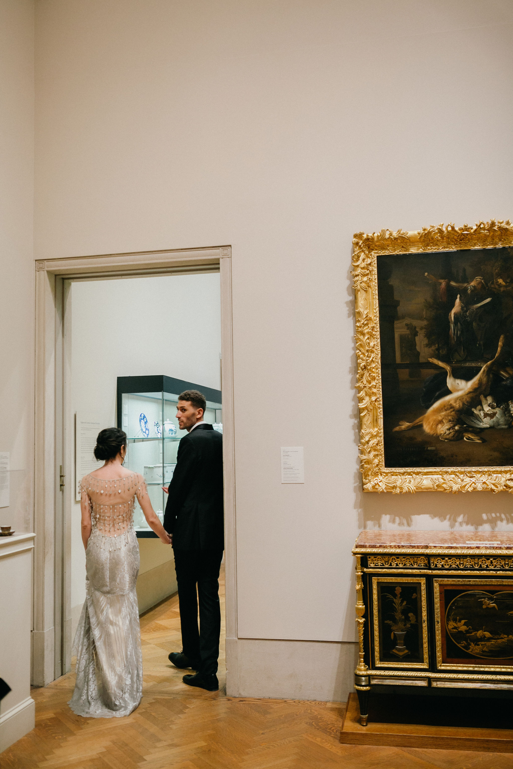 A joyful wedding moment set against a artsy backdrop at the PMA.