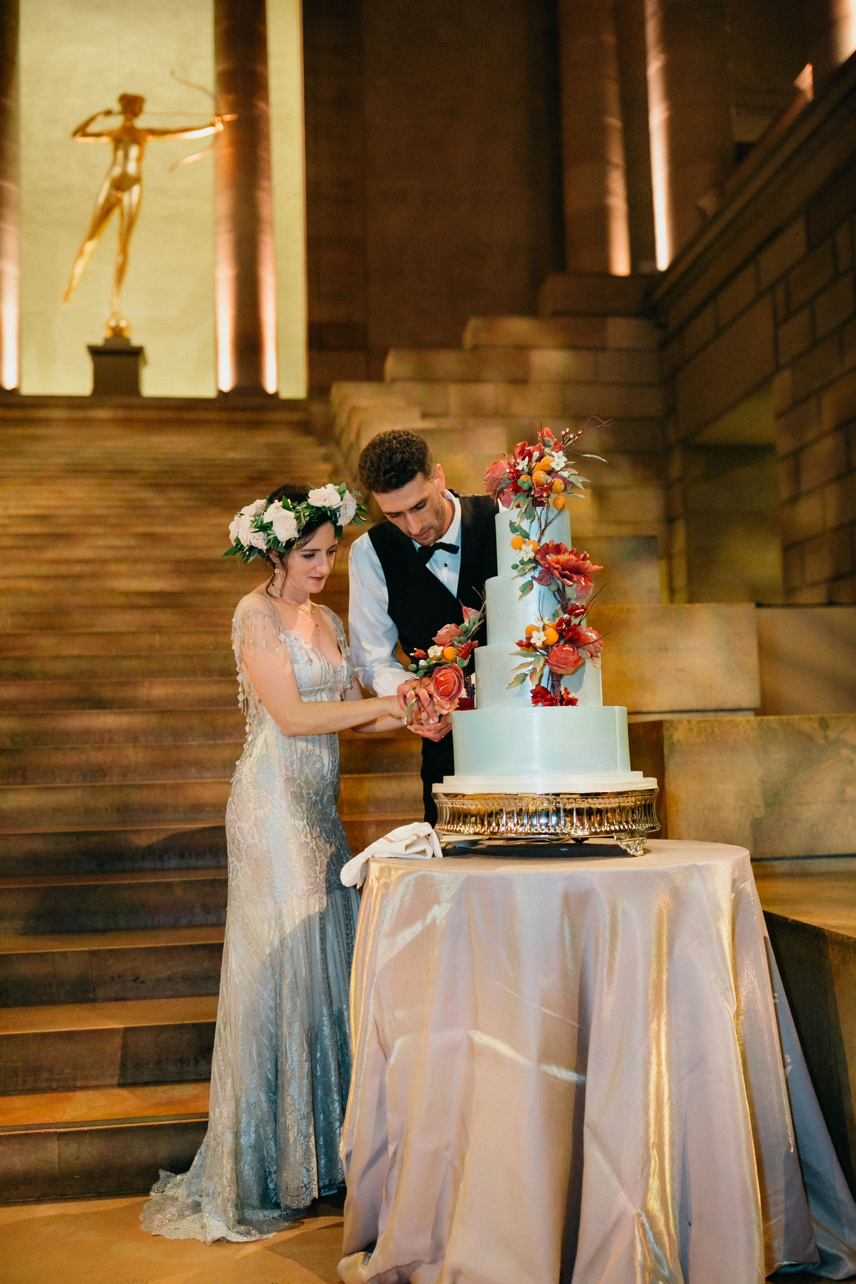 Newlyweds embrace during a memorable celebration at the Philadelphia Museum of Art.