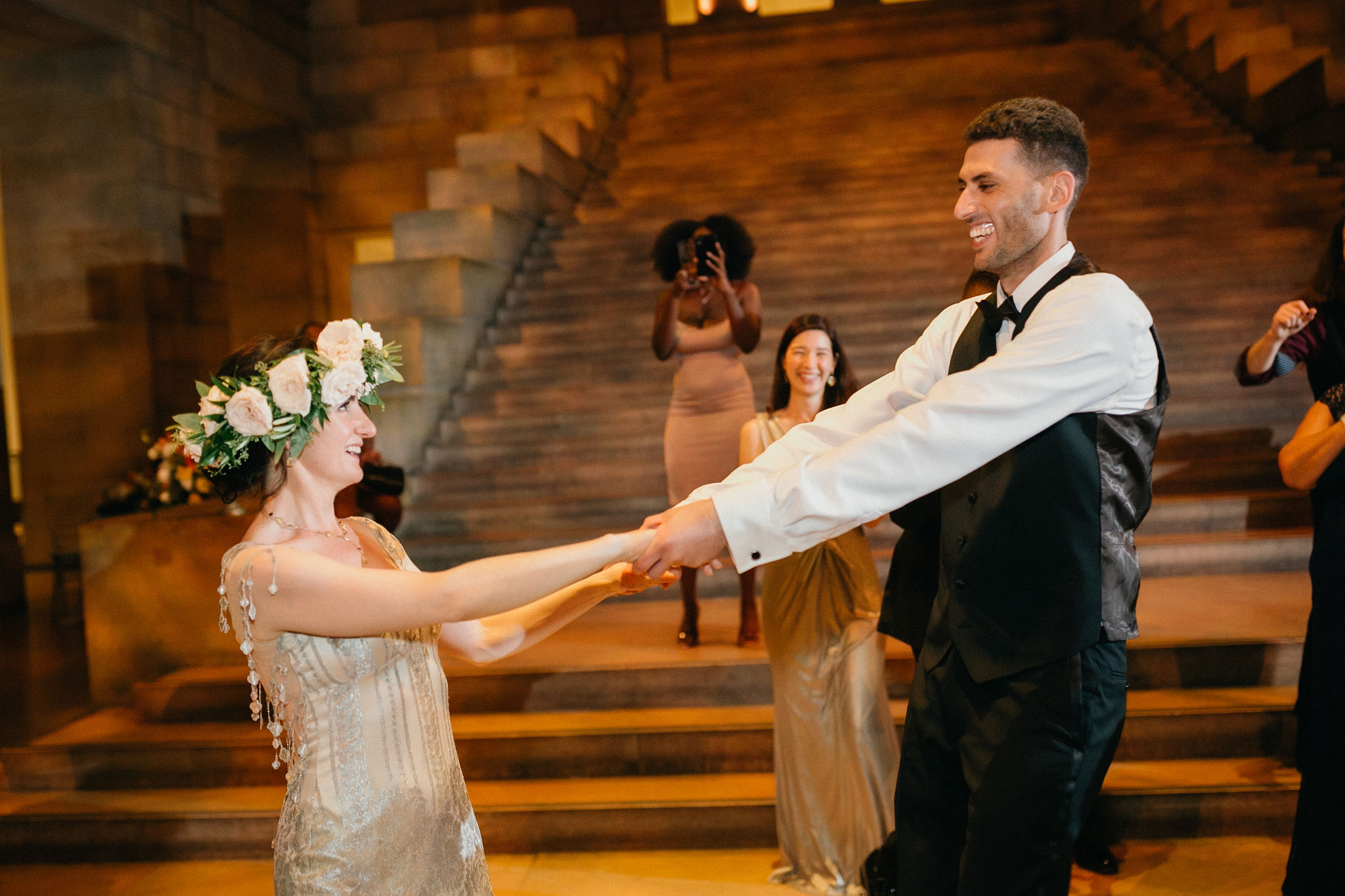 Newlyweds share a dance in a uniquely styled reception space at the Philly Art Museum.