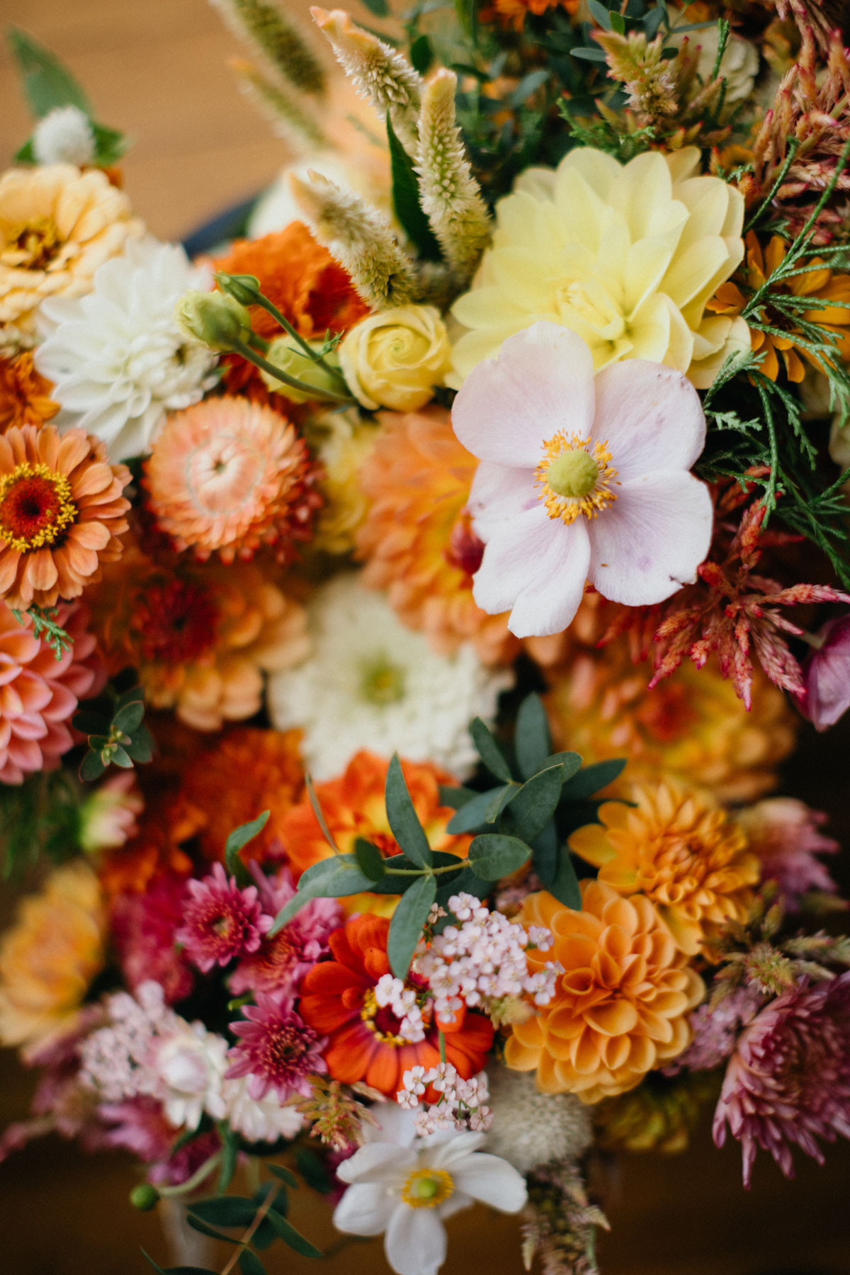 Colorful wedding bouquet with a warm sunset color palette.