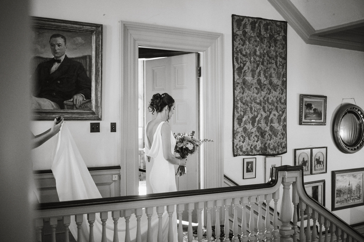 Glen Foerd wedding candid on the staircase.