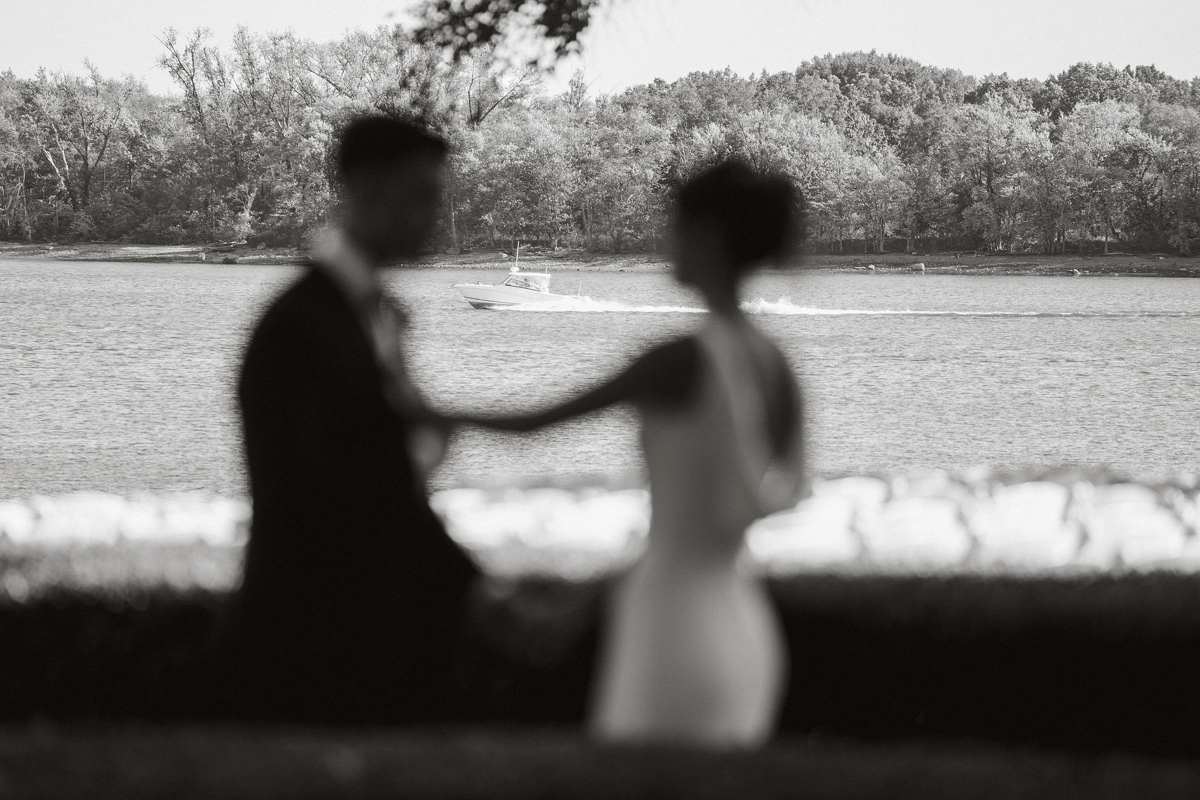 Out of focus shot of bride and groom before their waterfront Glen Foerd wedding.