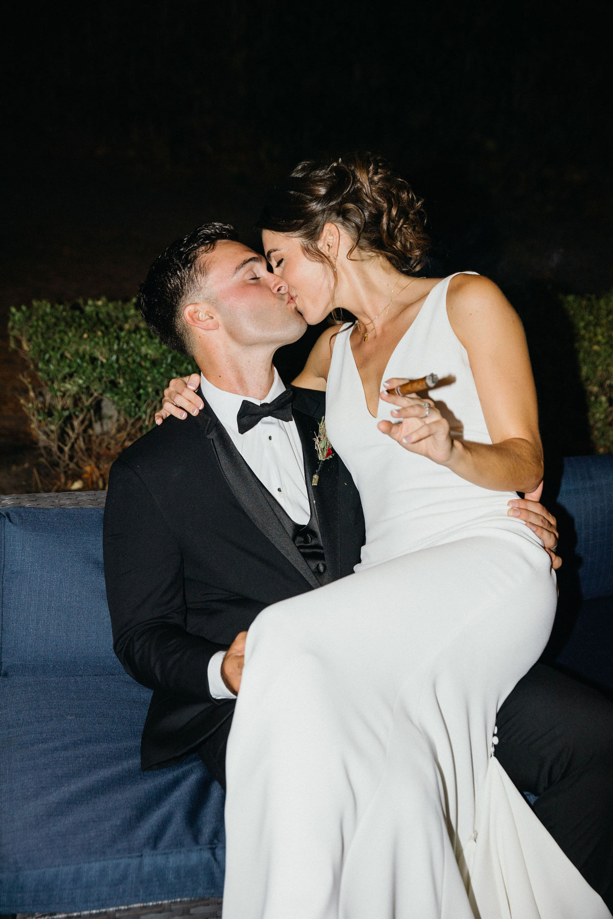 Direct flash photos of bride and groom smoking cigars at Glen Foerd wedding.