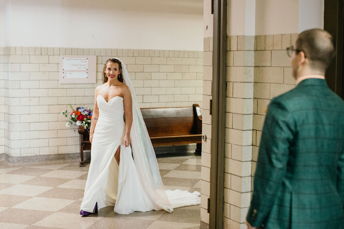 Bride turning the corner for her first look before her Bok wedding.