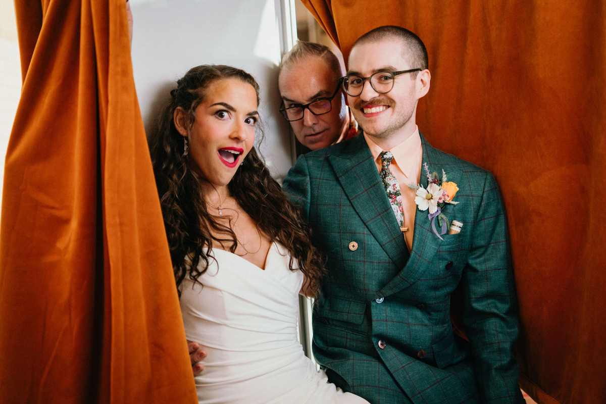 Guests posing with props in a quirky photo booth at the Bok venue.