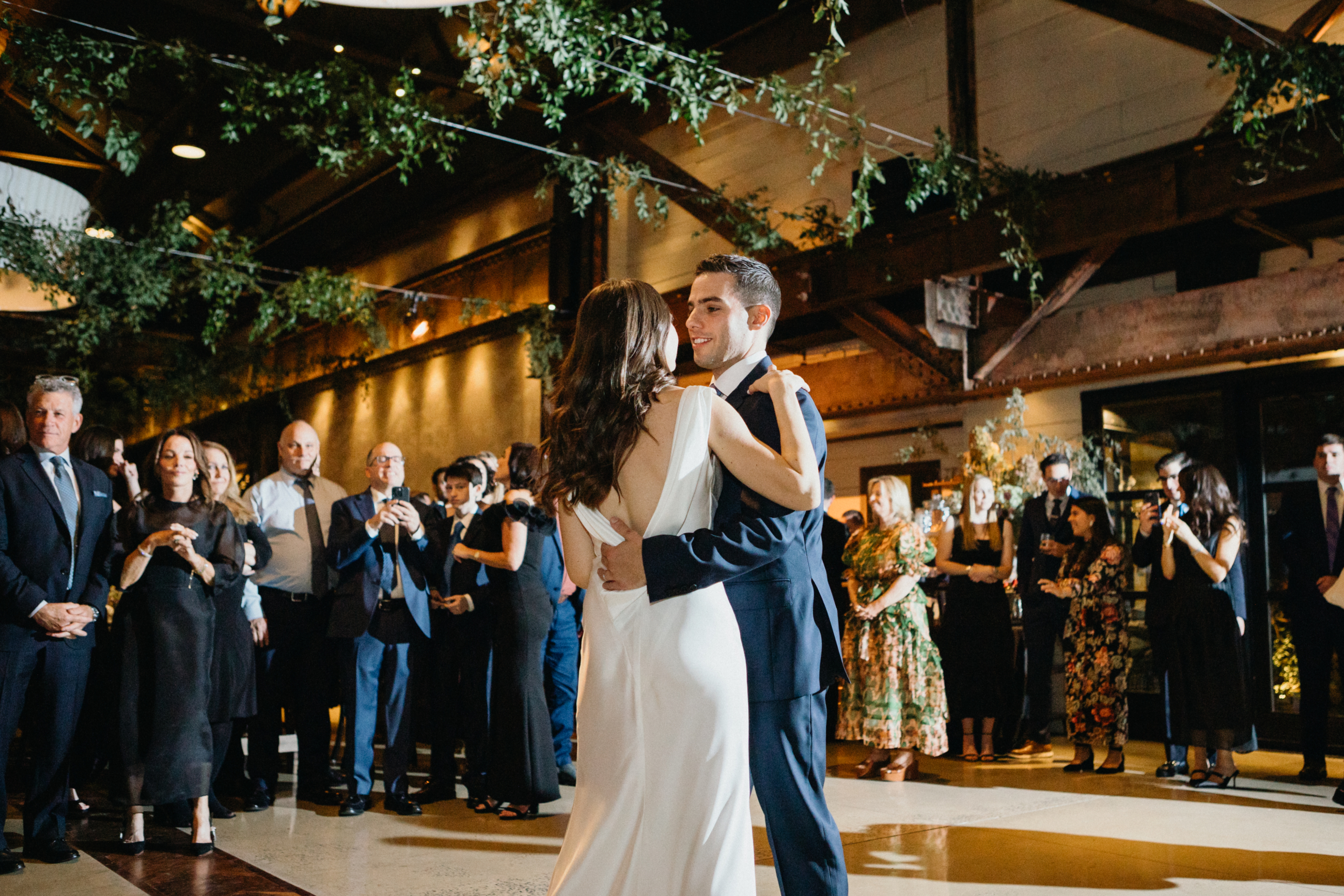 Share your first dance under the ornate chandeliers at The Pump House at Ironworks, a unique wedding venue in Philadelphia. 