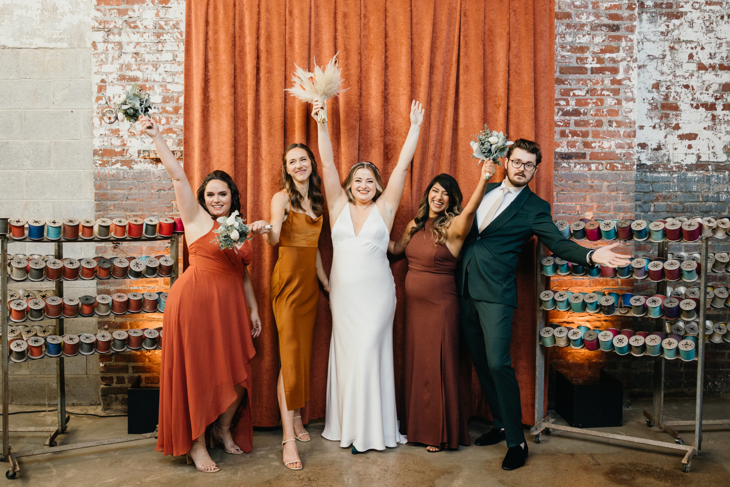 Fun, candid bridal party photo at a Global Dye Works wedding. 