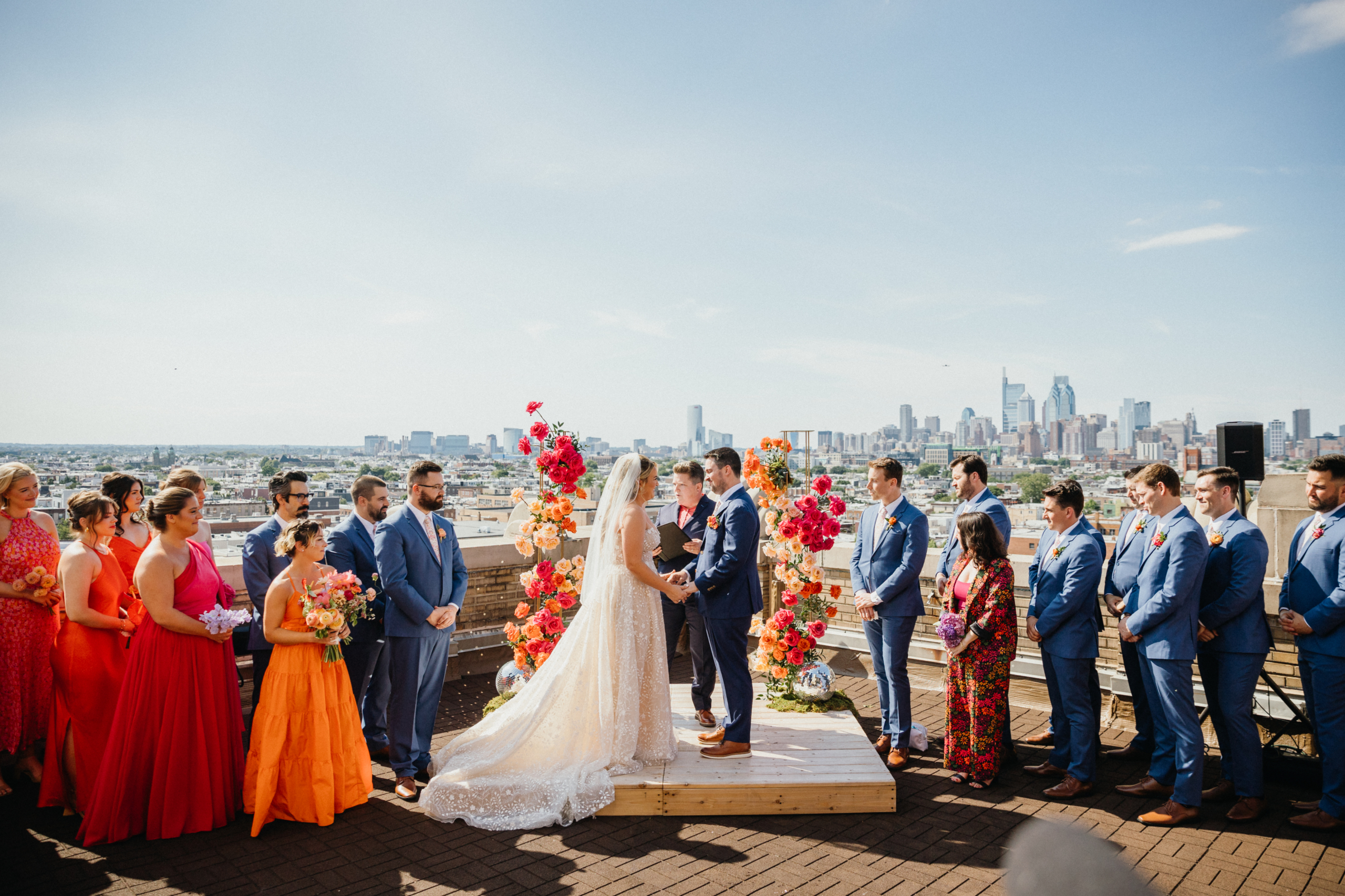 Brightly colored wedding ceremony held on the rooftop of the BOK building. 