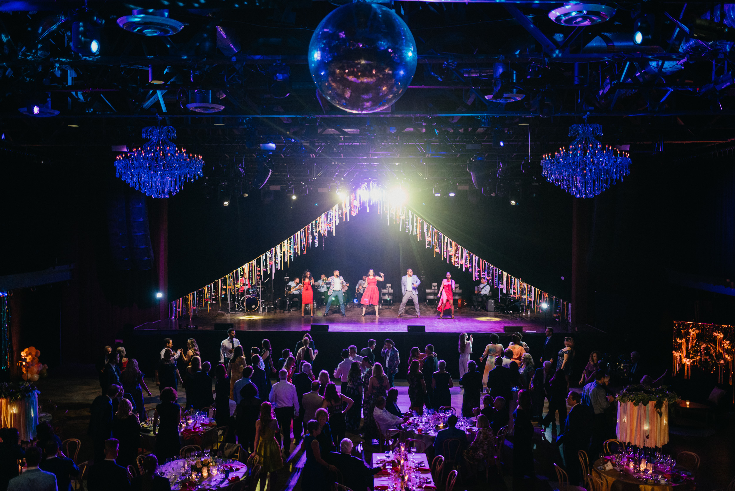 Have your wedding reception in a concert venue in Philadelphia, complete with disco ball chandelier and ticker tape. 