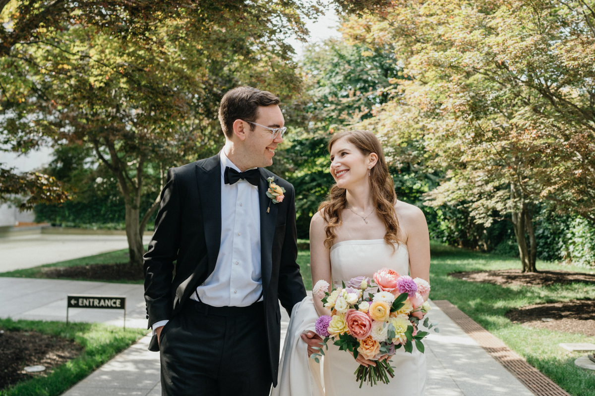 A candid shot of the couple during their ceremony at a museum wedding.