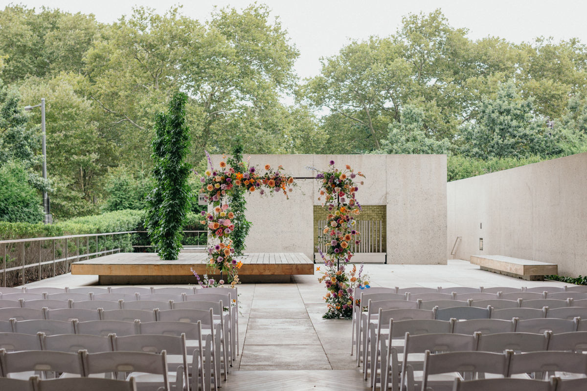 A sweeping view of the ceremony space inside a top museum wedding