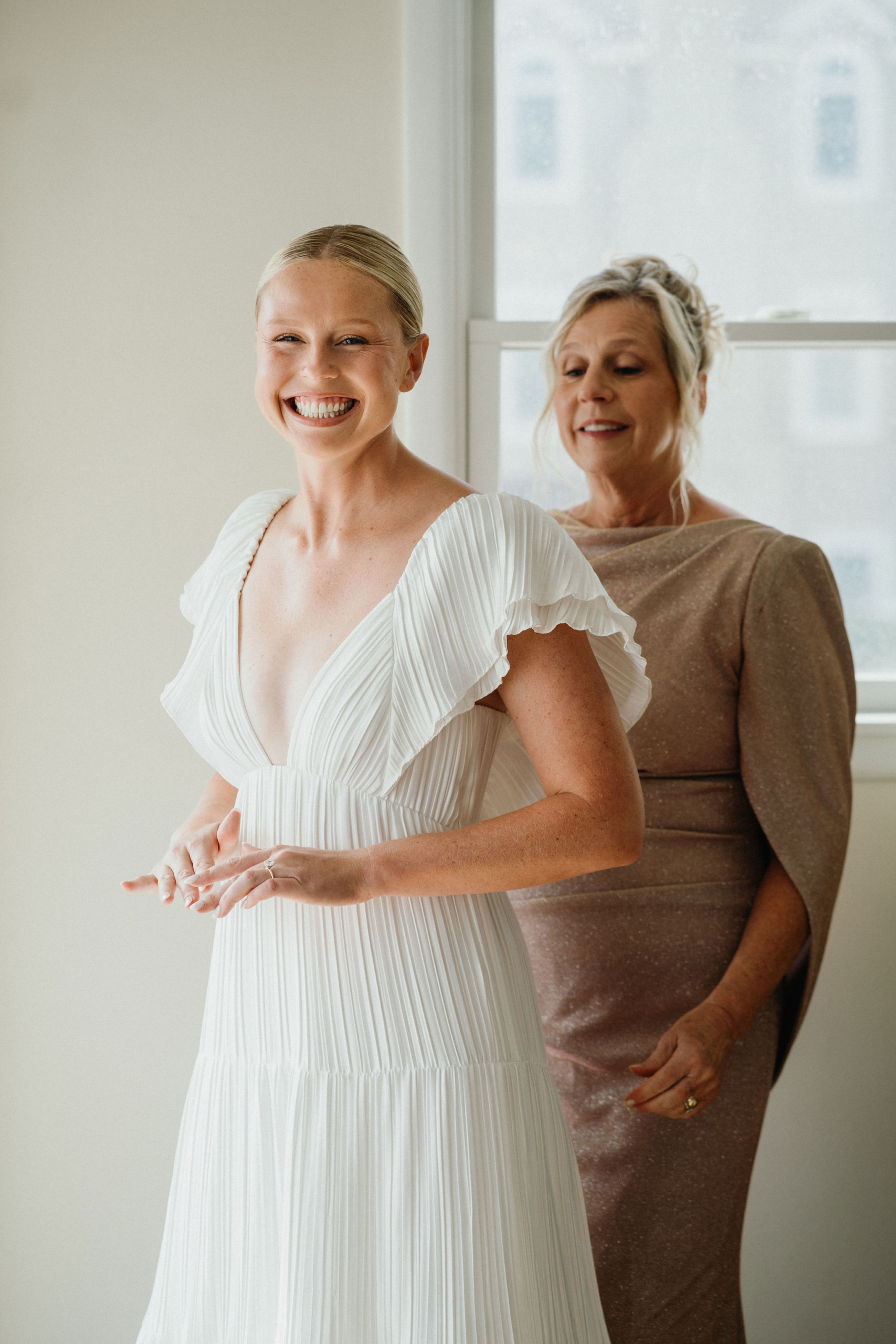 Laughter fills the room as the bridal party gets ready.