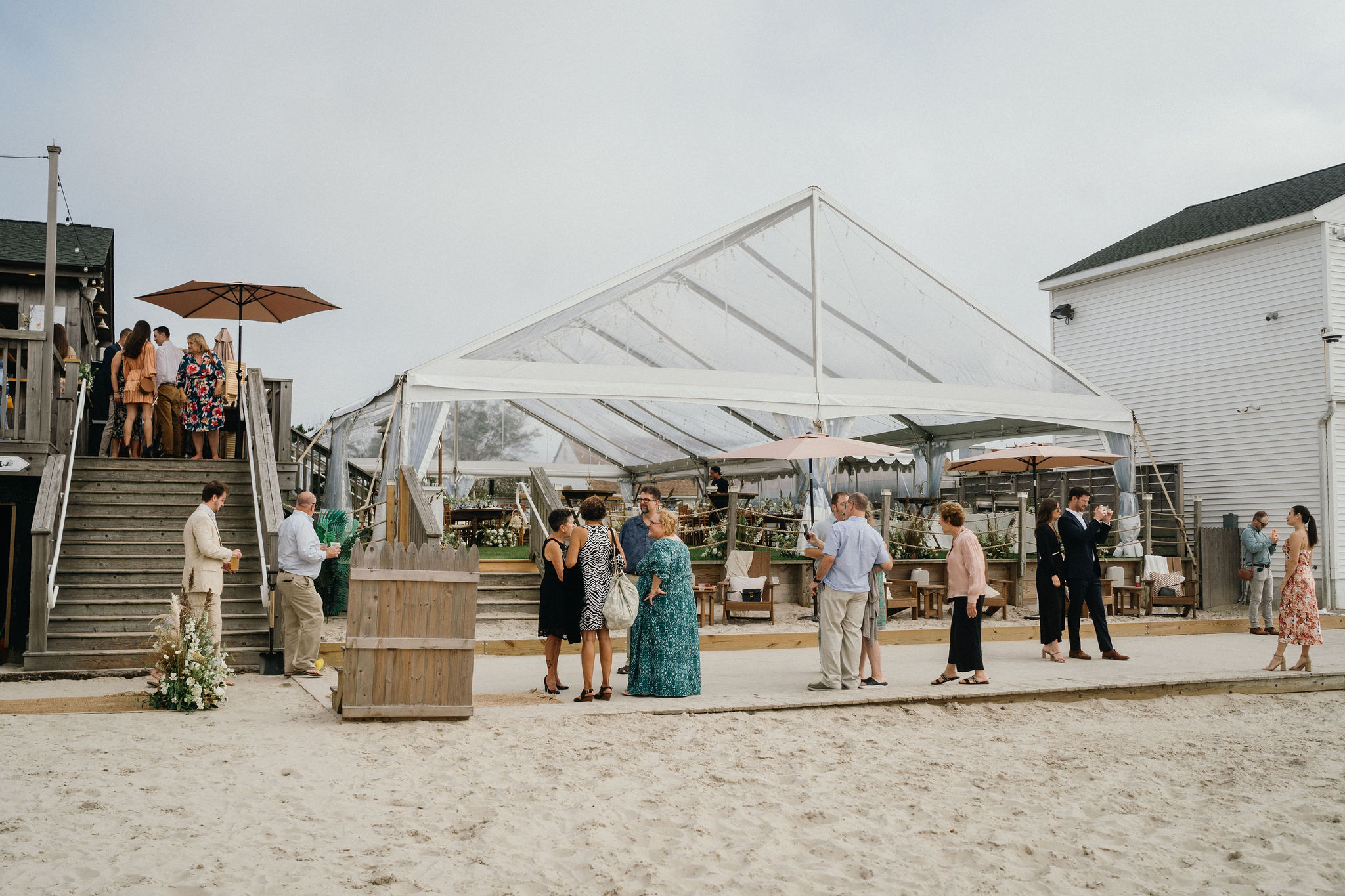 Friends and family gathered to witness a beachfront wedding ceremony at Deauville Inn in OCNJ.