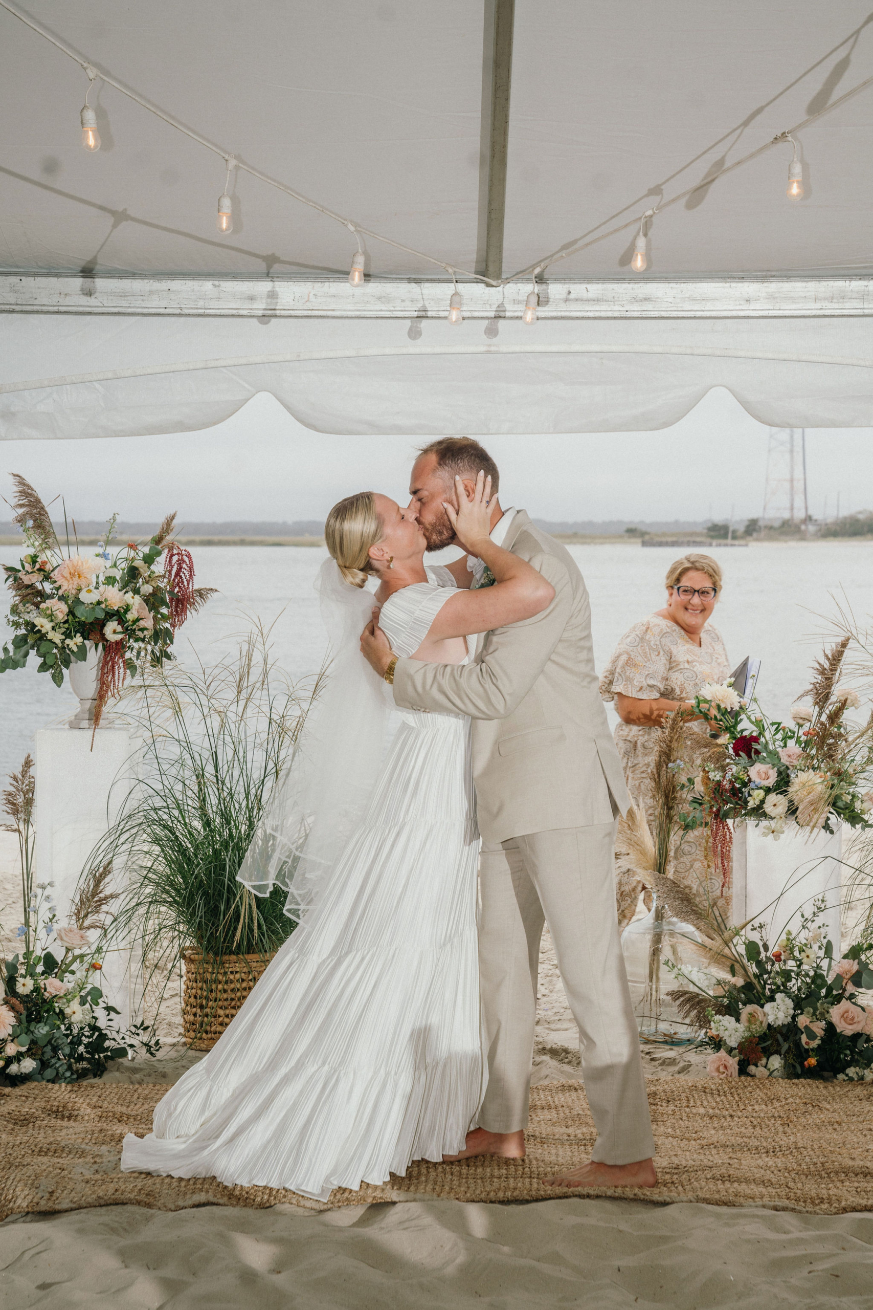 A kiss seals the moment at a Deauville Inn wedding.