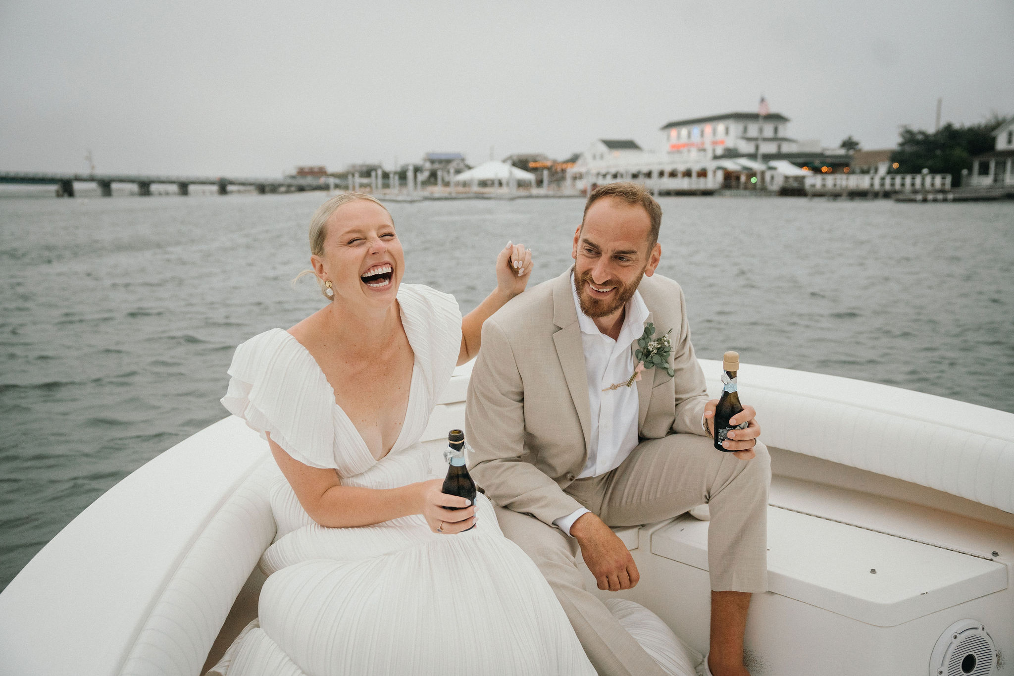 A quiet toast while drifting on the bay after Deauville Inn wedding. 