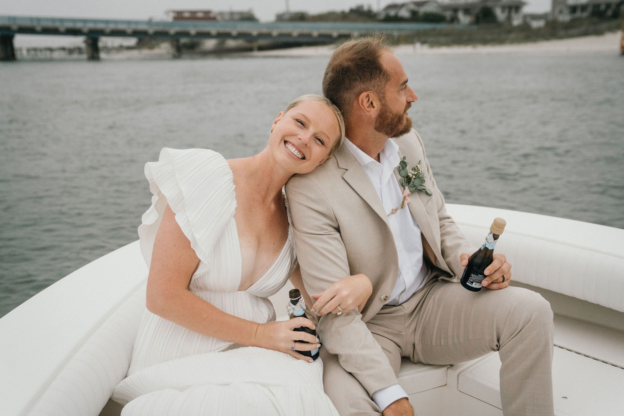 Soft waves accompany the newlyweds’ boat ride.