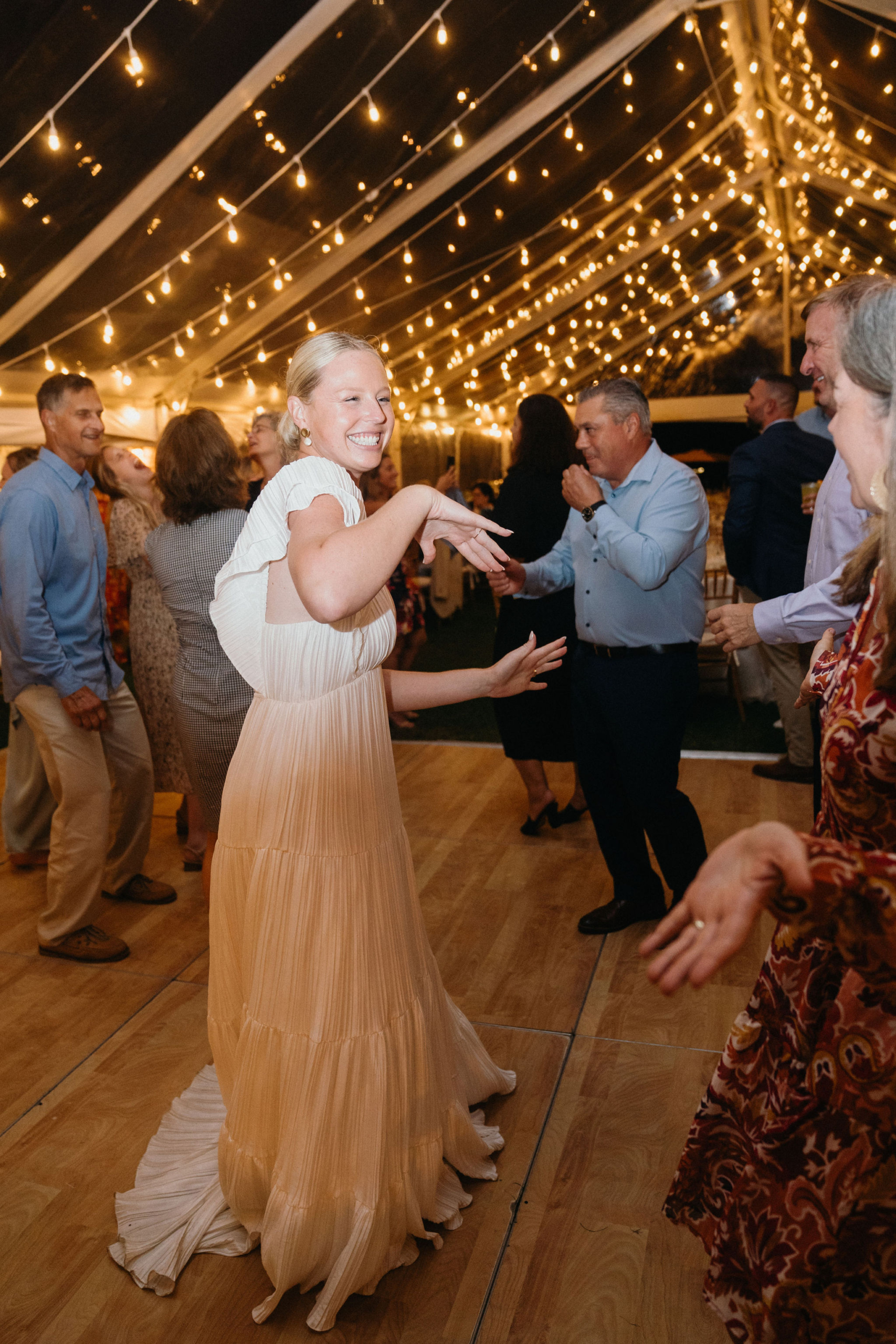 Laughter and clinking glasses at an Ocean City, NJ wedding.