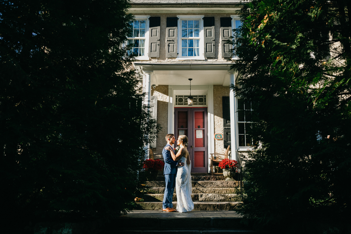 Estate wedding venue featuring timeless stonework and dreamy floral arches.