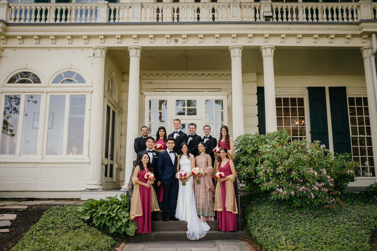 Estate wedding venue featuring ivy-covered walls and a secluded garden.