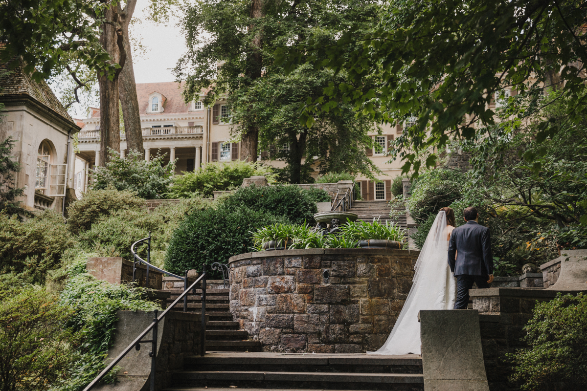 Elegant historic estate wedding venue with sprawling gardens and a grand stone façade.