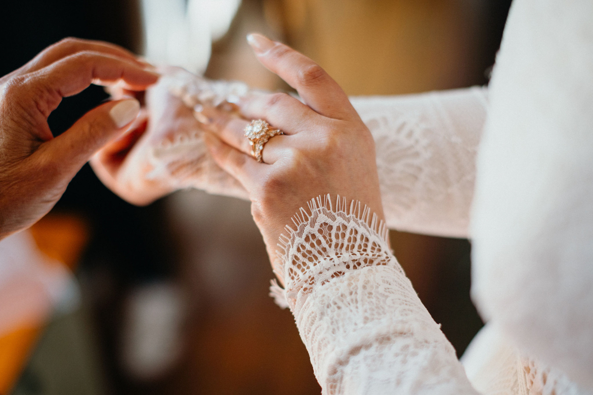 A close-up of heirloom jewelry incorporated into the bride’s wedding look.