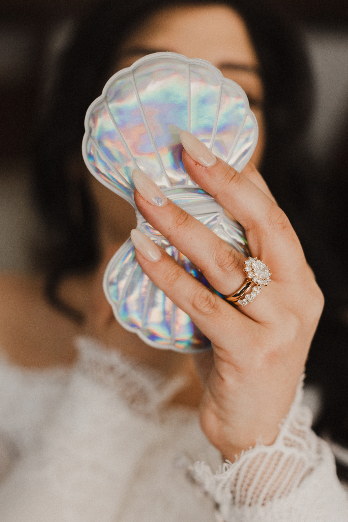 A rustic and ethereal wedding mirror compact with vintage charm.