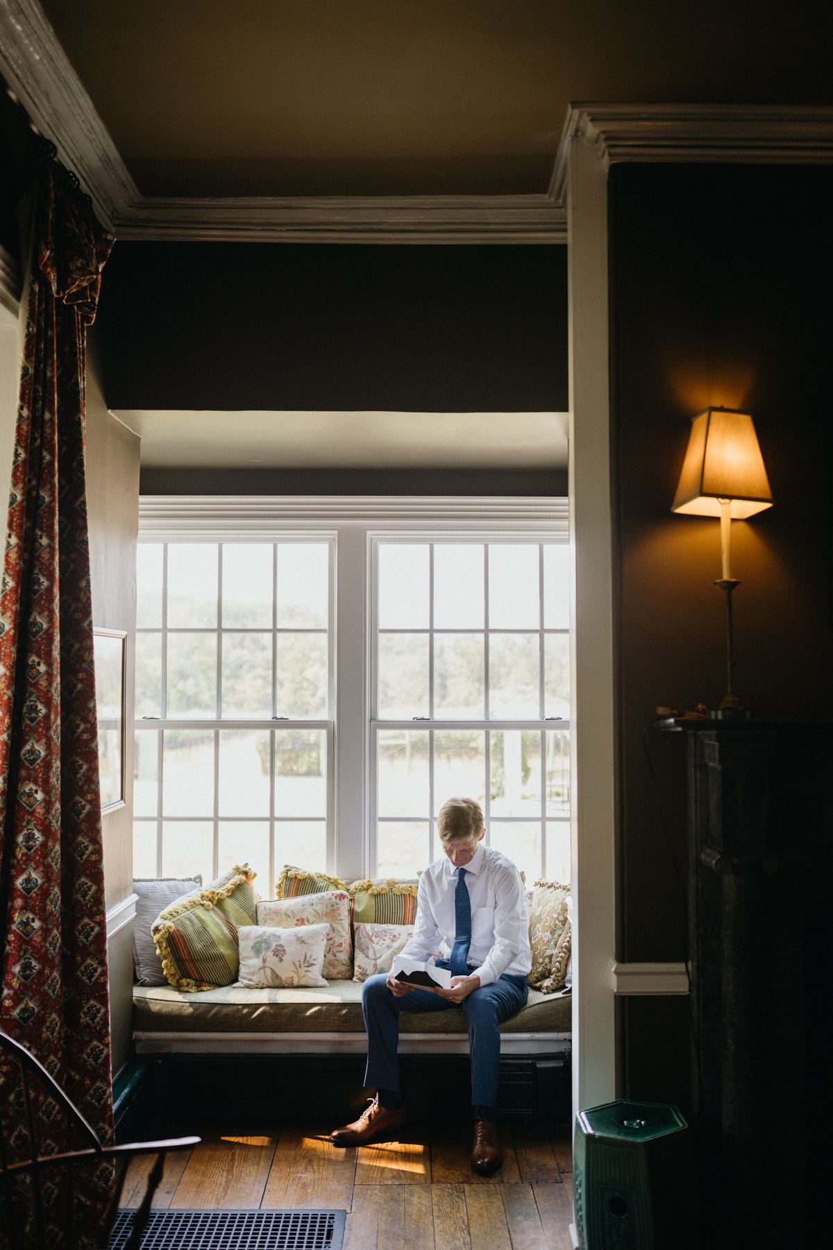 Quiet moment before groom sees his bride on wedding day at Grace Winery